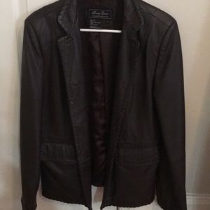100% brown leather coat/blazer. Polyester lined.